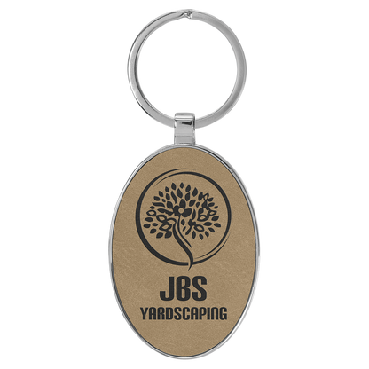 3" x 1.75" Light Brown Metal Oval Leatherette Keychain – item GFT2150