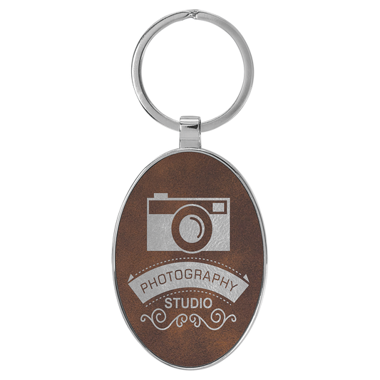 3" x 1.75" Rustic/Silver Metal Oval Leatherette Keychain – item GFT2157