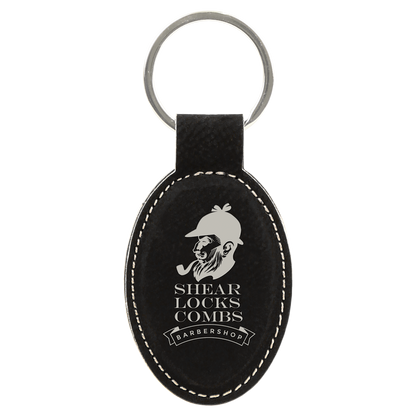 3" x 1.75" Black/Silver Oval Leatherette Keychain – item GFT601