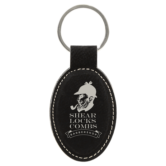 3" x 1.75" Black/Silver Oval Leatherette Keychain – item GFT601